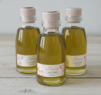 Bomboniere olio biologico aromatizzato 100ml con tappo in sughero e etichetta orsetto rosa